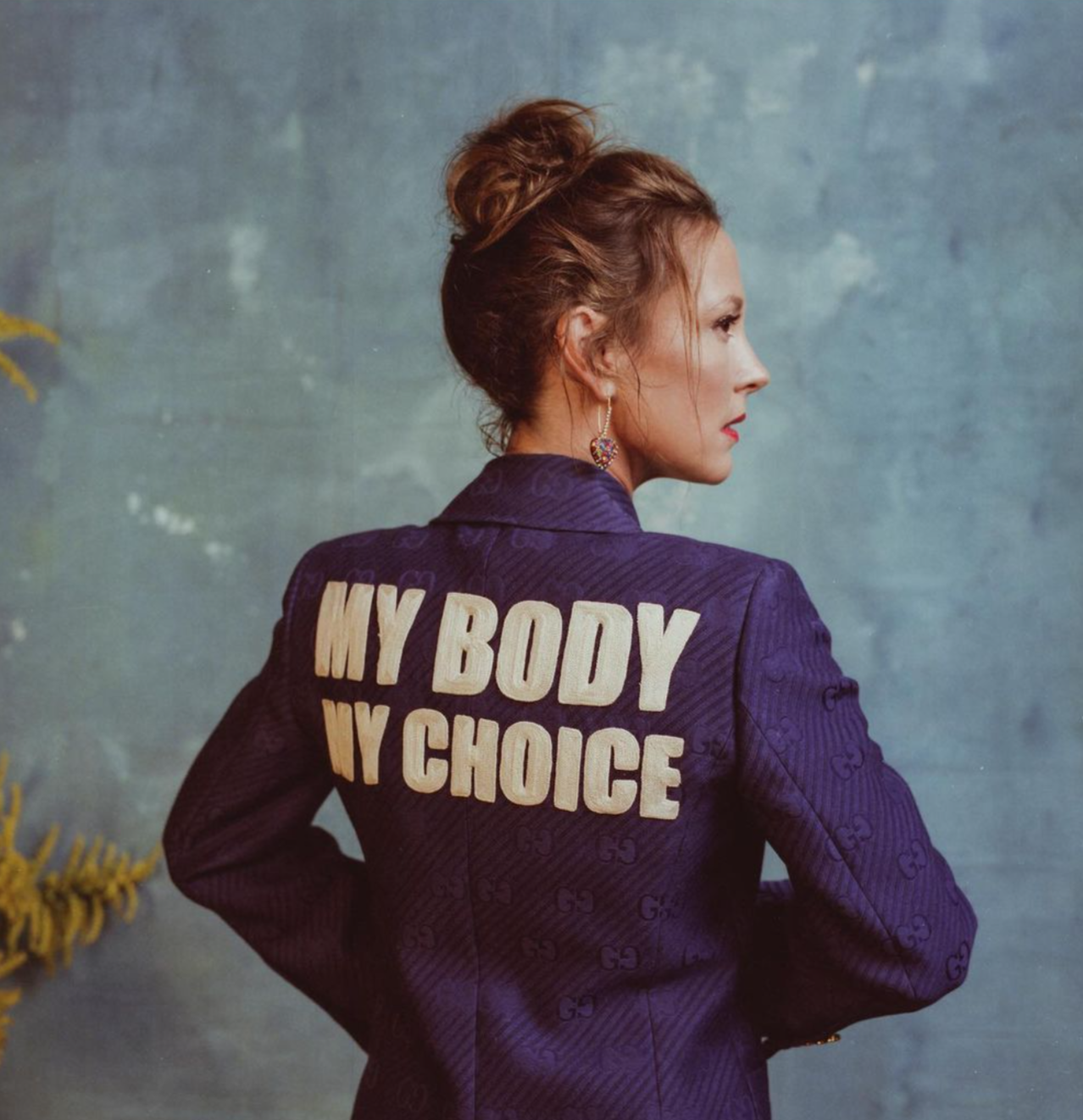 Amanda Shires wears a fitted jacket that reads "My Body My Choice" on the back